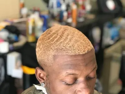 Blond waves with skin fade