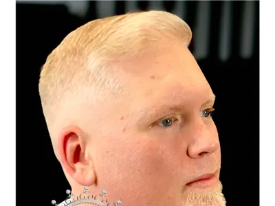 Blond quiff with tight fade